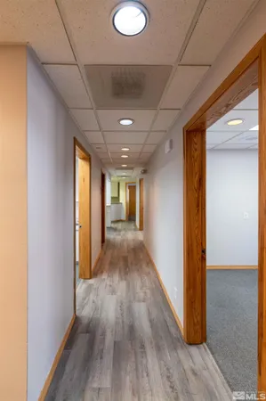 a view of hallway with wooden floor