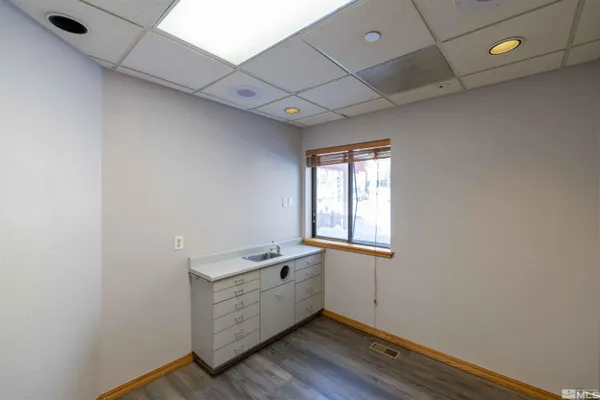 a room with window and wooden floor