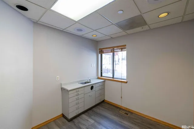 a room with window and wooden floor