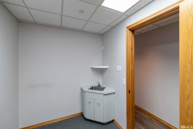 a bathroom with a sink a mirror and a toilet