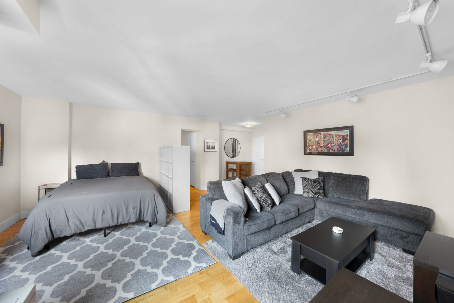 101 West 12th Street, Unit 9Z Manhattan, NY 10011 - Photo 5 of 15 a spacious bedroom with a bed and couch