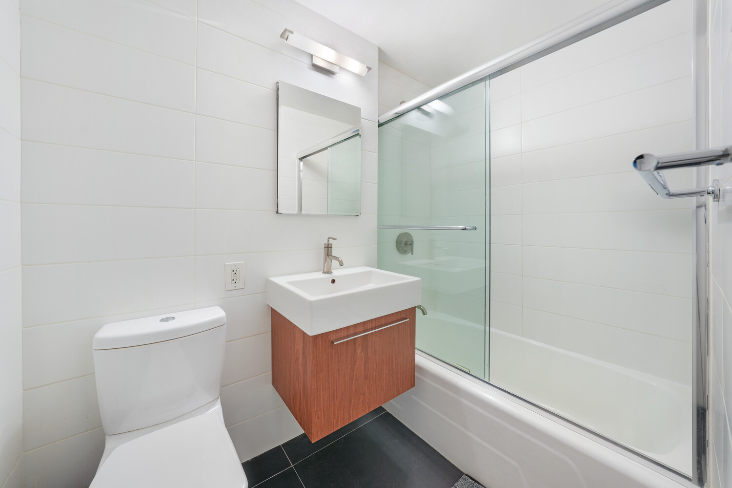 101 West 12th Street, Unit 9Z Manhattan, NY 10011 - Photo 8 of 15 a bathroom with a sink a toilet and shower