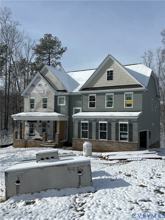 a front view of a building with a yard and balcony
