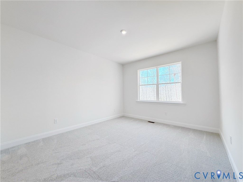 4041 Tredon Road Mechanicsville, VA 23111 - Photo 14 of 35 The first-floor guest suite features an ensuite ba