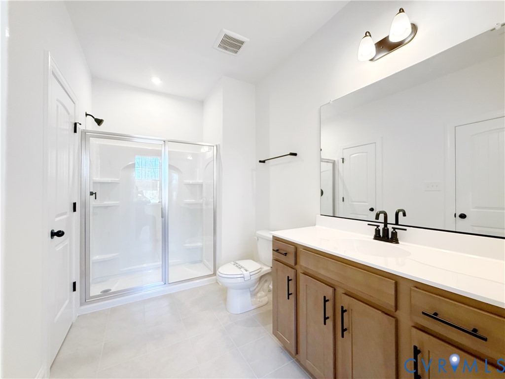 4041 Tredon Road Mechanicsville, VA 23111 - Photo 15 of 35 The first-floor guest suite features an ensuite ba