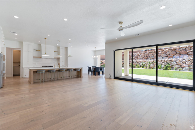 1192 East Corral Way Washington, UT 84780 - Photo 15 of 81 Spacious open-concept living area featuring light wood-finish flooring and recessed lighting