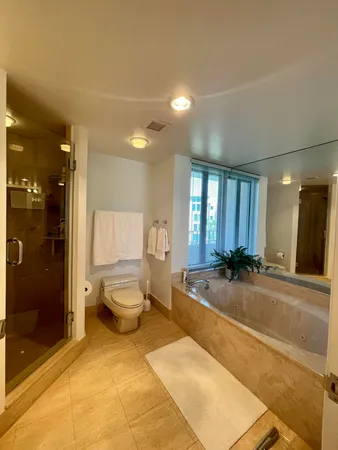 a spacious bathroom with a tub and shower