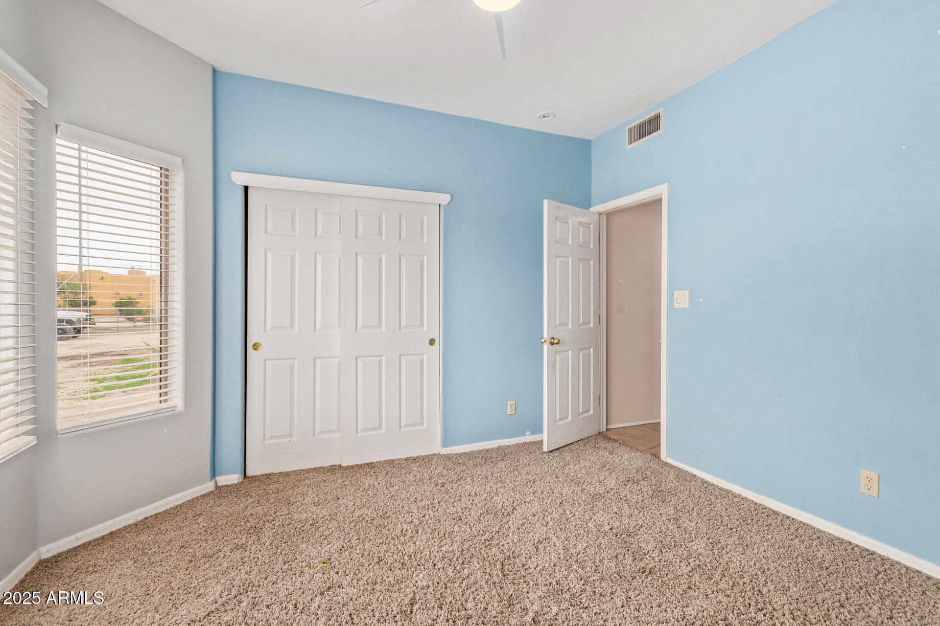 1032 East Carlise Road Phoenix, AZ 85086 - Photo 27 of 56 a view of an empty room and window