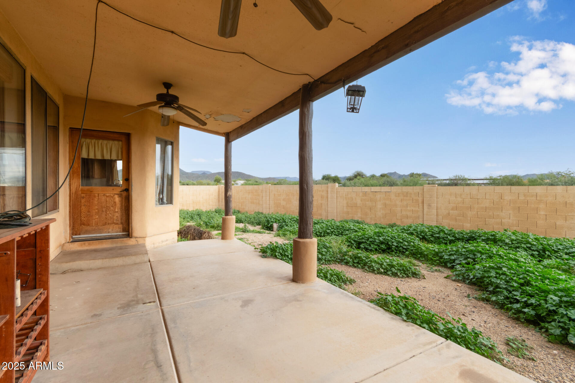 1032 East Carlise Road Phoenix, AZ 85086 - Photo 34 of 56 a view of a house with backyard and a patio