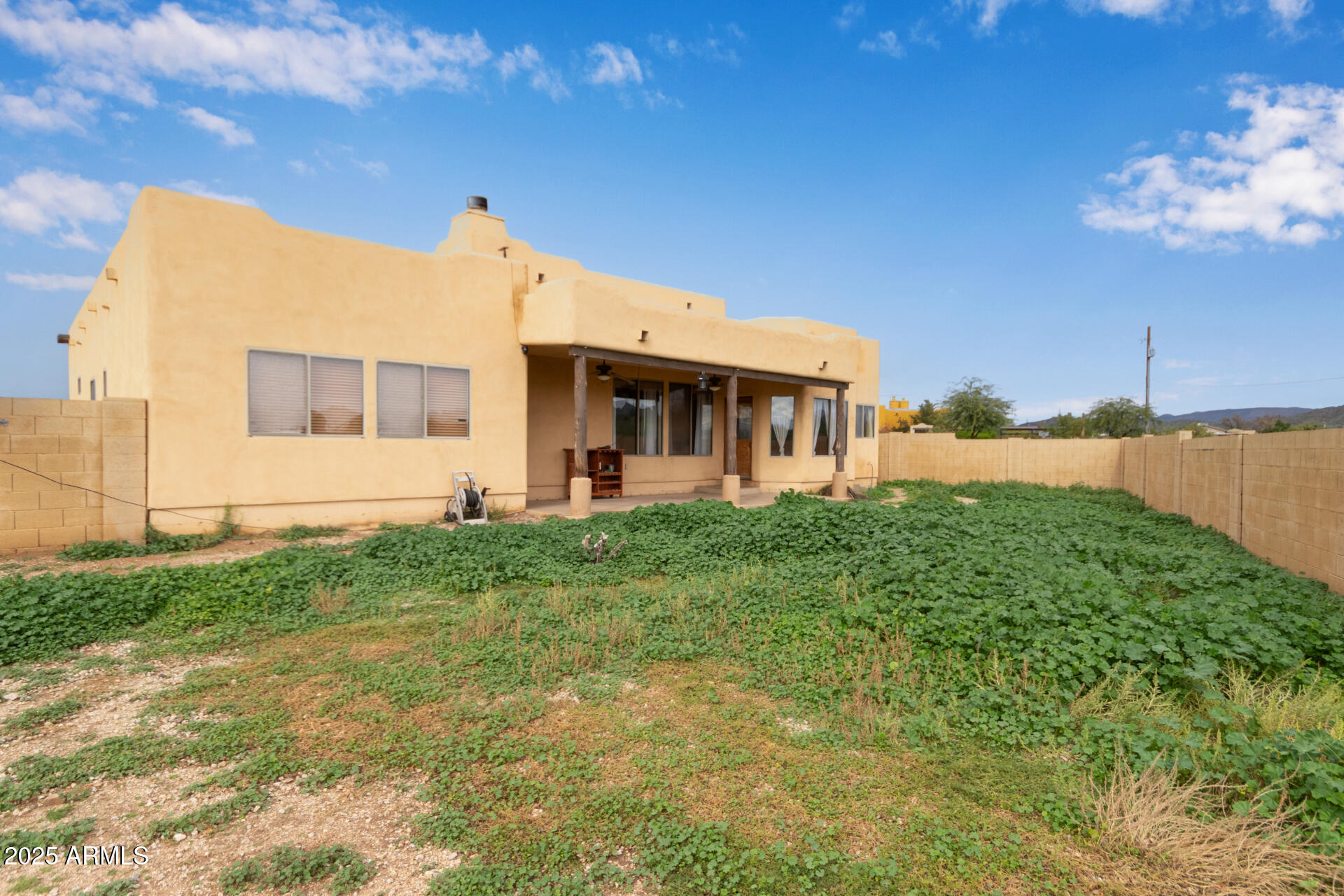 1032 East Carlise Road Phoenix, AZ 85086 - Photo 37 of 56 a view of a house with backyard porch and garden