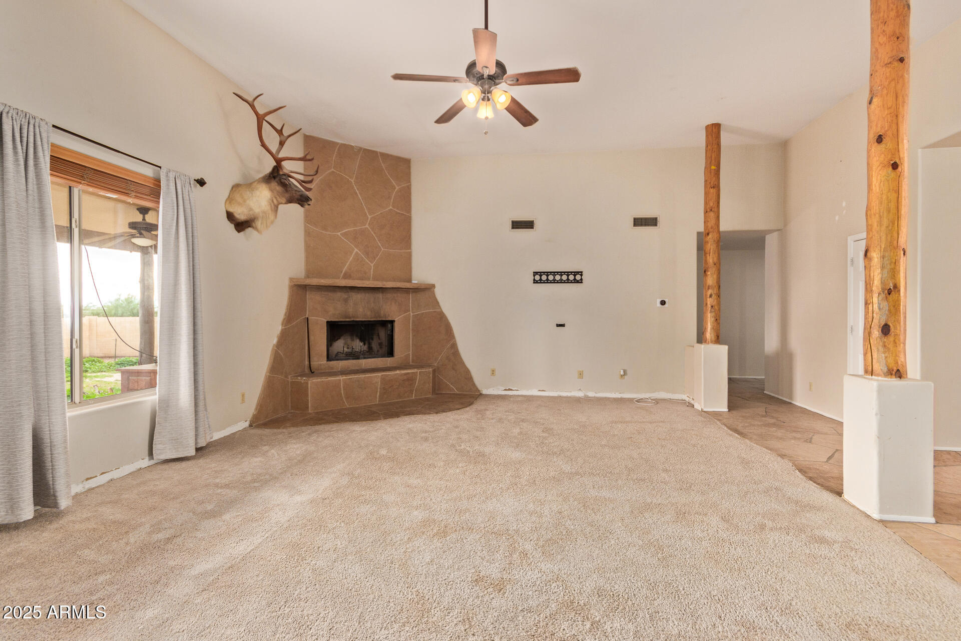 1032 East Carlise Road Phoenix, AZ 85086 - Photo 10 of 56 an empty room with windows and cabinet