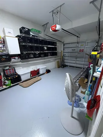 a utility room with closet dryer and washer
