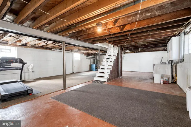 a view of empty room with wooden ceiling