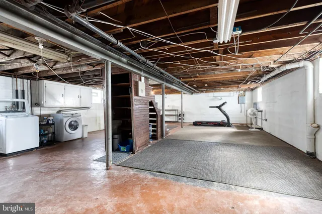 a view of empty room with wooden ceiling