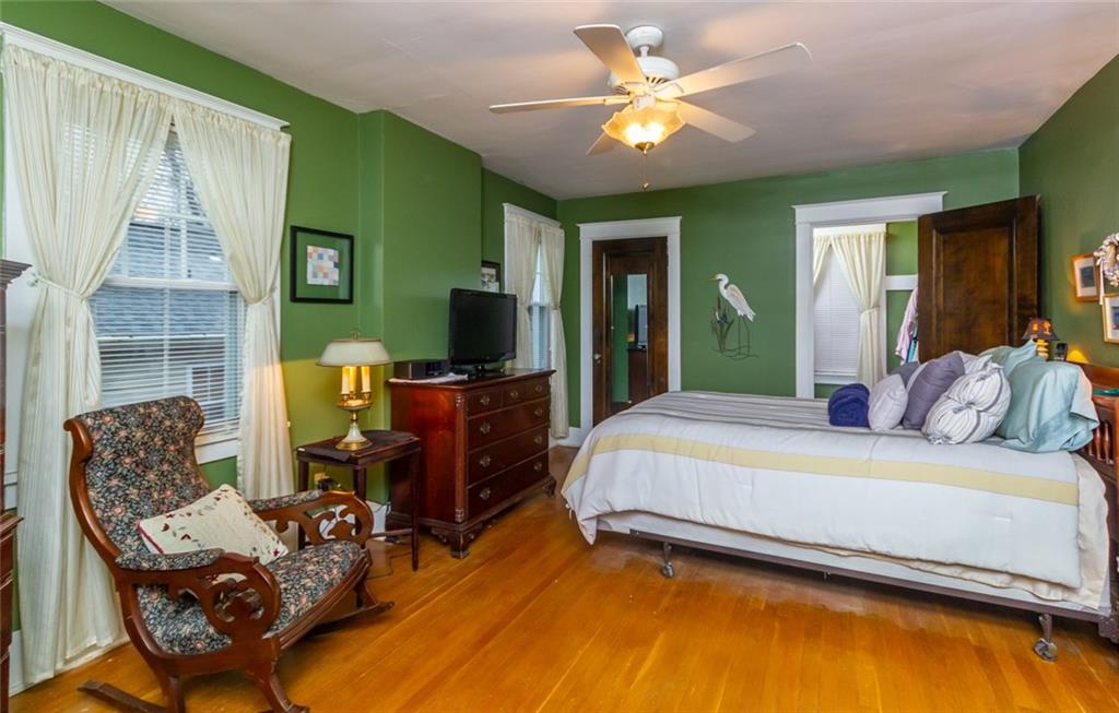 644 Cascade Road Pittsburgh, PA 15221 - Photo 12 of 21 a bedroom with a bed and furniture