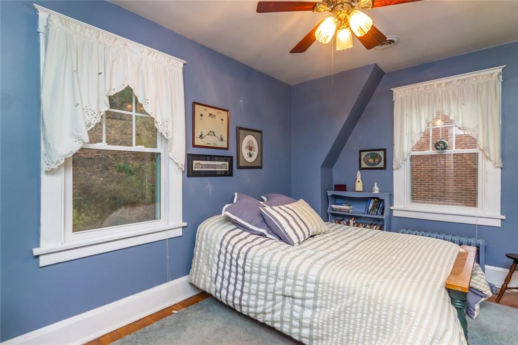 644 Cascade Road Pittsburgh, PA 15221 - Photo 16 of 21 a bedroom with a bed and a window
