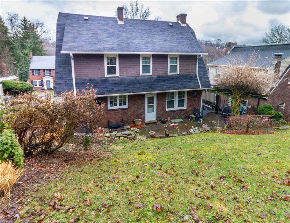 644 Cascade Road Pittsburgh, PA 15221 - Photo 20 of 21 a front view of a house with garden