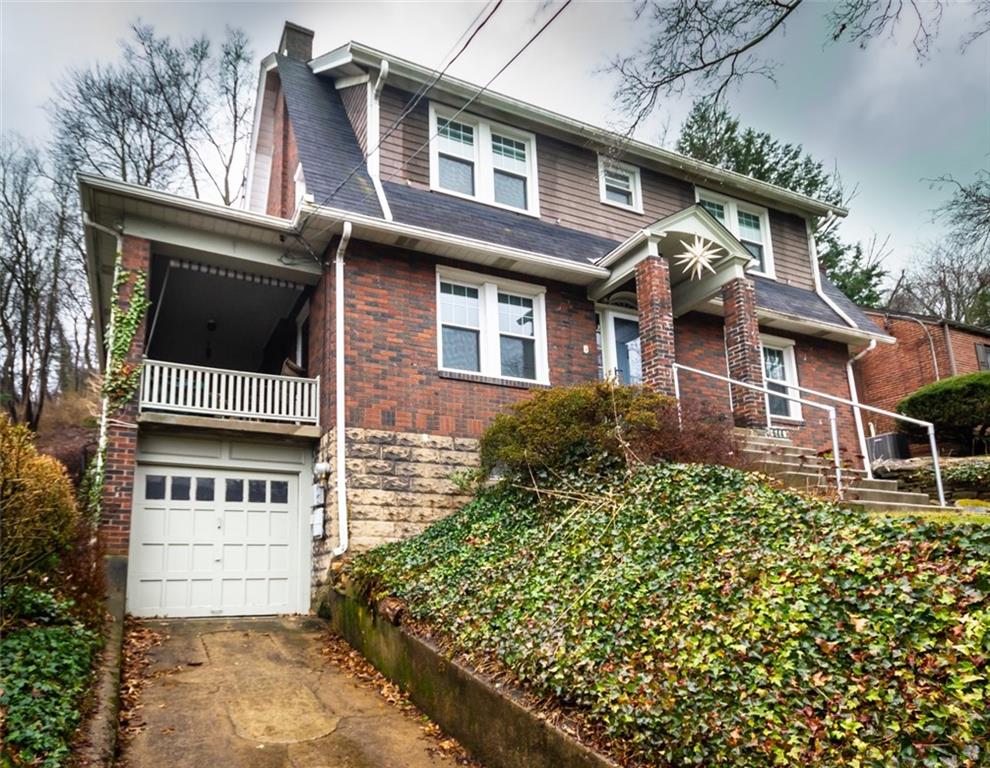 644 Cascade Road Pittsburgh, PA 15221 - Photo 21 of 21 a front view of a house with a yard