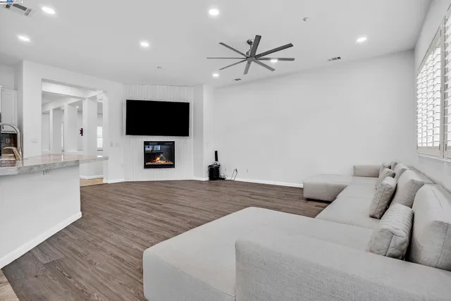 a view of kitchen with microwave and refrigerator