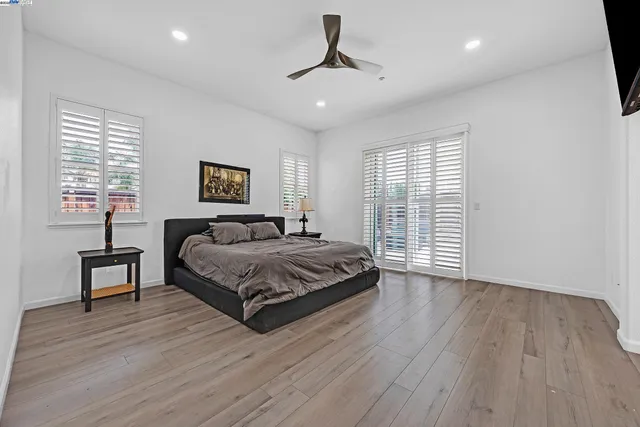 a spacious bathroom with a tub sink shower and mirror