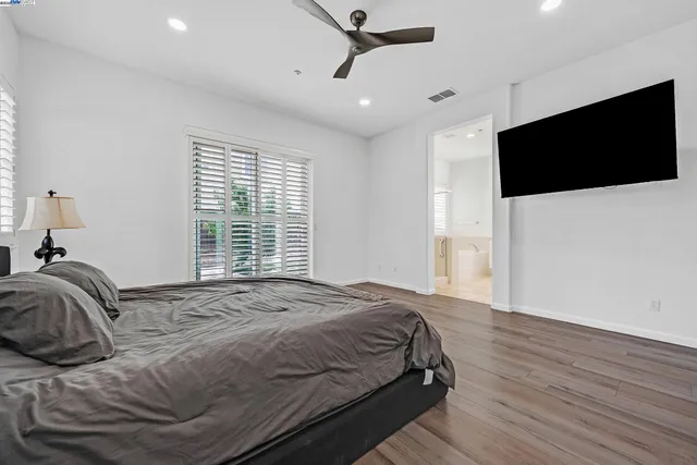 a spacious bathroom with a double vanity sink mirror double and bathtub