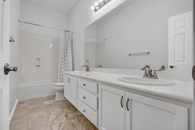 a bathroom with a toilet and a bathtub