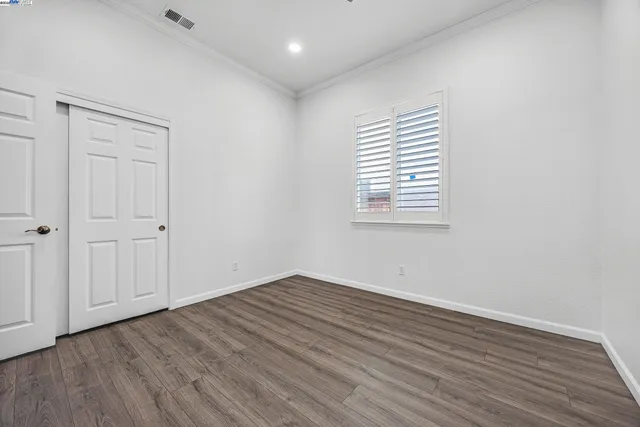 a view of backyard with outdoor seating and barbeque oven