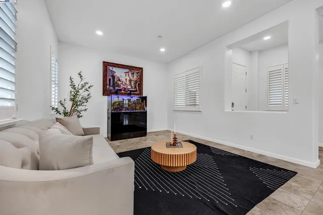 a living room with furniture and a rug