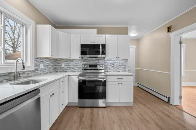a kitchen with a stove and a sink