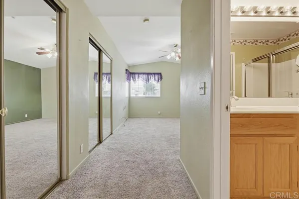 a view of hallway with livingroom