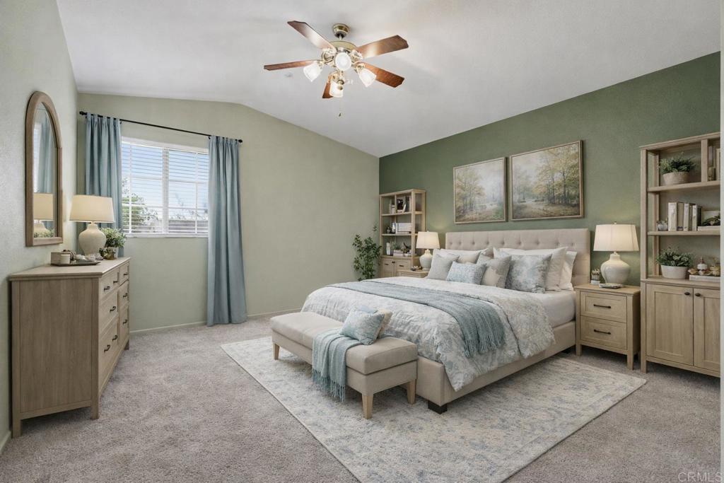 1340 H Street Ramona, CA 92065 - Photo 13 of 27 a spacious bedroom with a bed and a chandelier