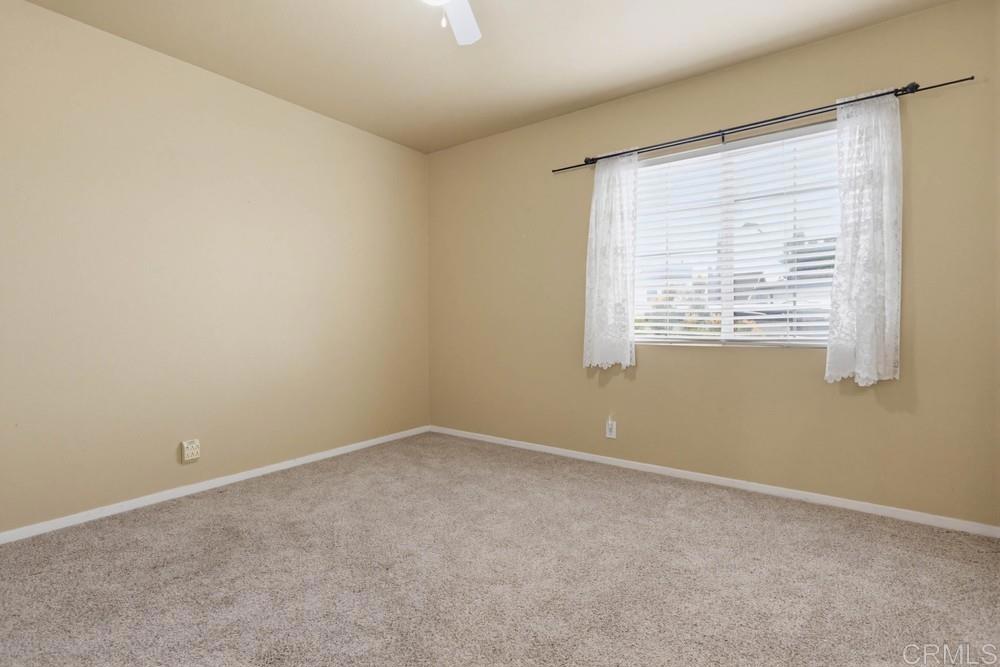 1340 H Street Ramona, CA 92065 - Photo 19 of 27 a view of an empty room with a window