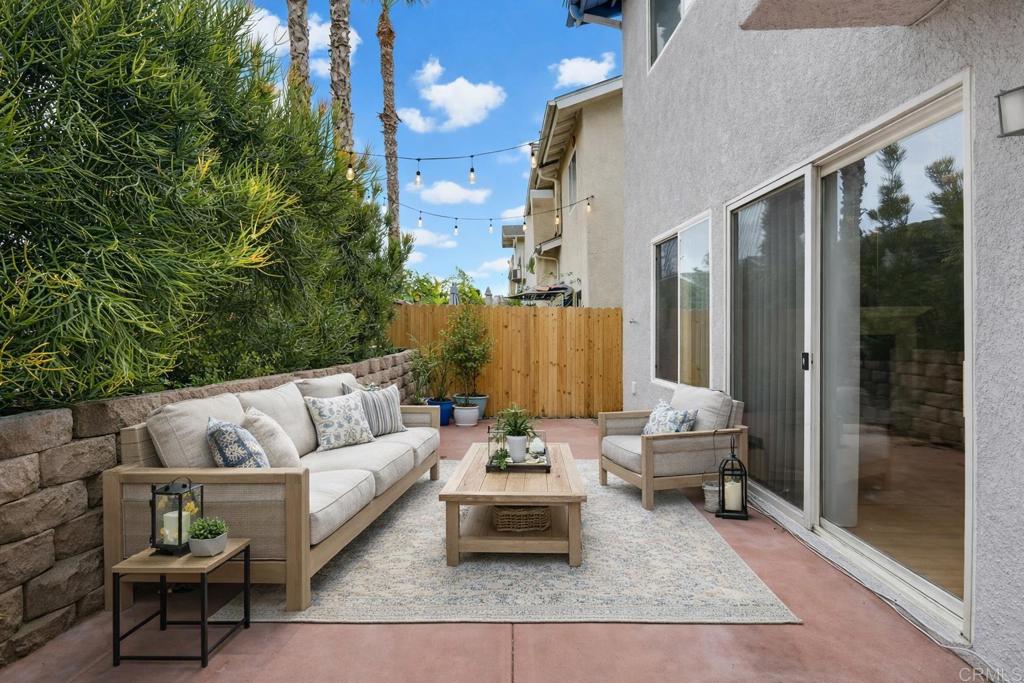 1340 H Street Ramona, CA 92065 - Photo 21 of 27 a view of a patio with couches and a potted plant on a table