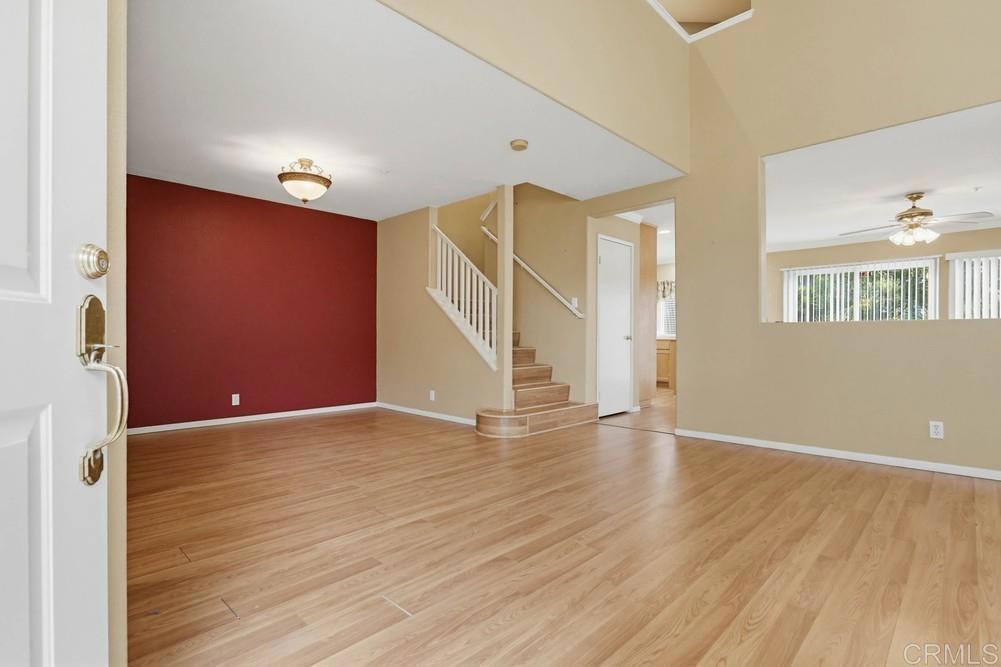 1340 H Street Ramona, CA 92065 - Photo 3 of 27 a view of an empty room with wooden floor and a window