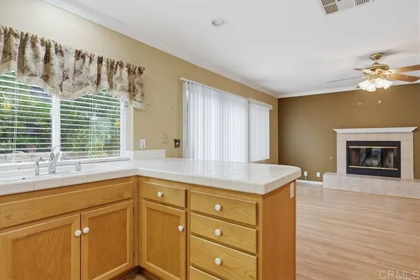a kitchen with a sink and a window