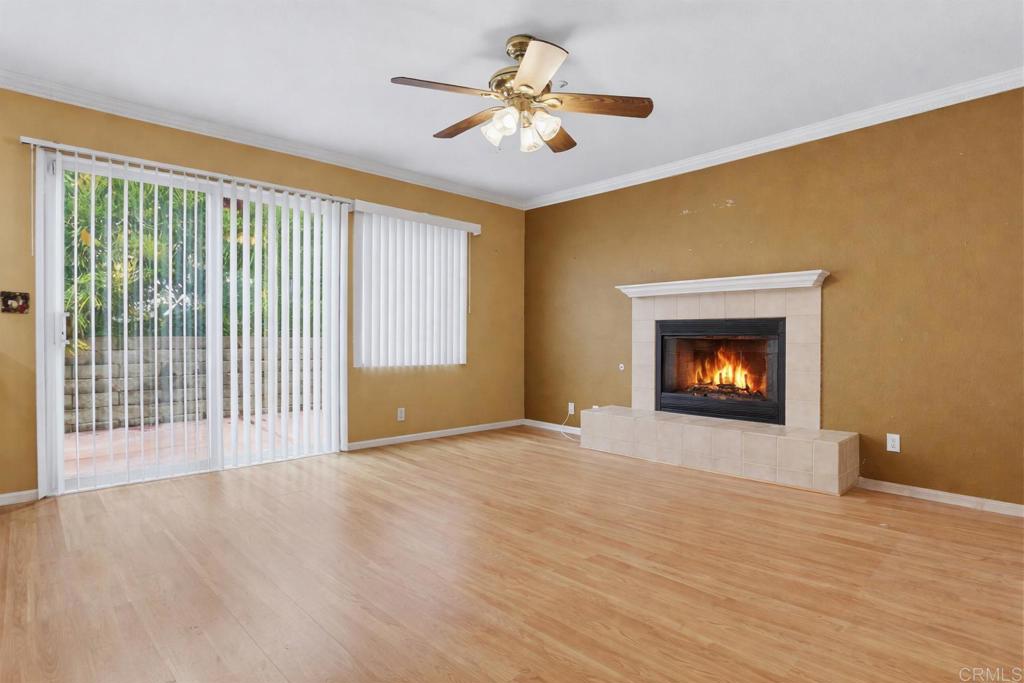 1340 H Street Ramona, CA 92065 - Photo 8 of 27 a view of an empty room with a fireplace and a window