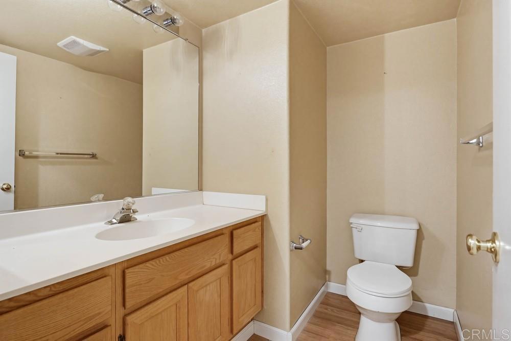 1340 H Street Ramona, CA 92065 - Photo 9 of 27 a bathroom with a sink toilet and a mirror