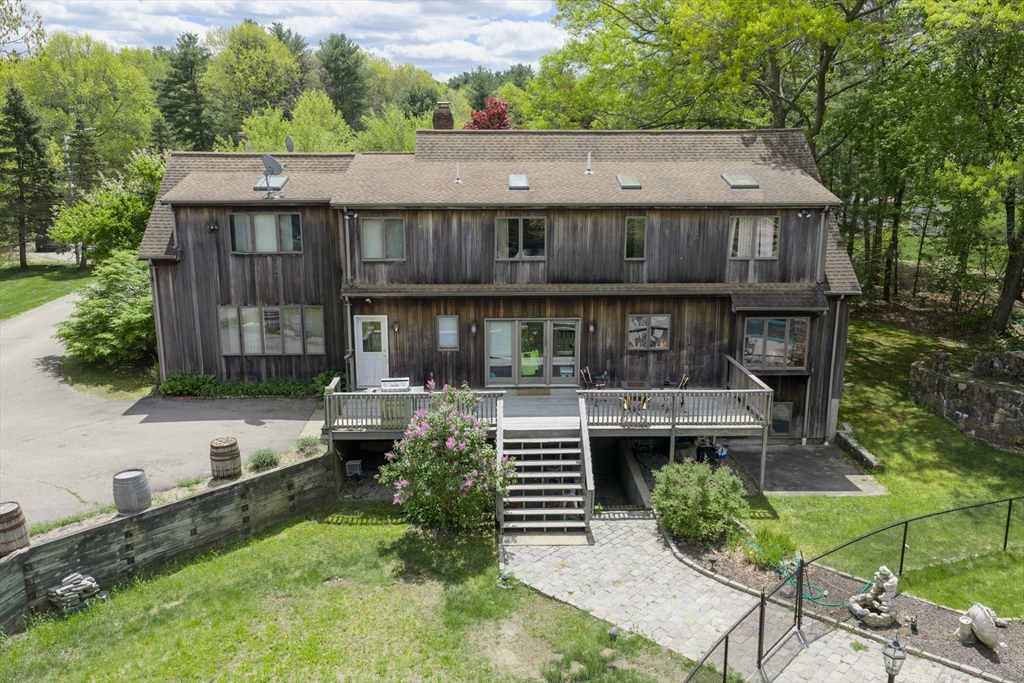 42 Pine Acres Road Foxboro, MA 02035 - Photo 32 of 40 a house view with a garden space