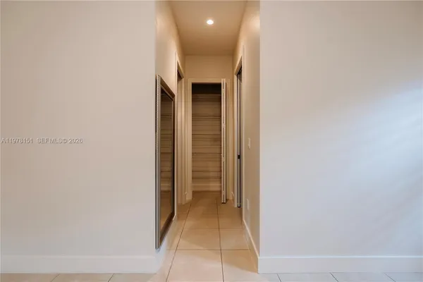 a view of a living room with a hallway