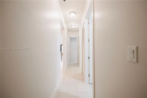 a view of a bathroom with a sink and mirror