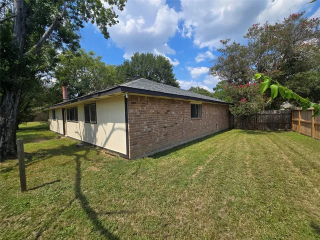 a backyard of a house with lots of green space