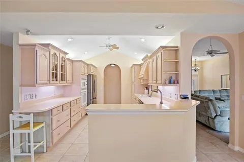 a open kitchen with stainless steel appliances granite countertop a sink and cabinets