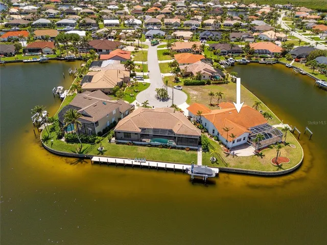 an aerial view of a house with a ocean view