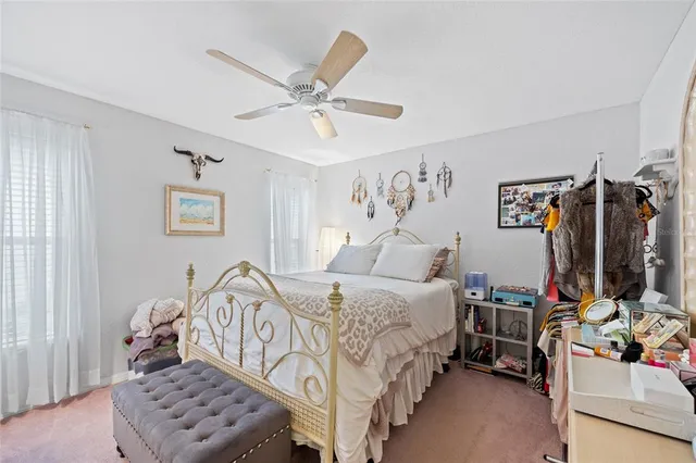 a view of a patio with dining table and chairs
