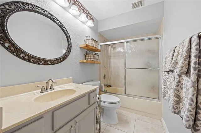 a dining room with a table and chairs