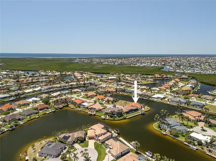an aerial view of a house with a swimming pool