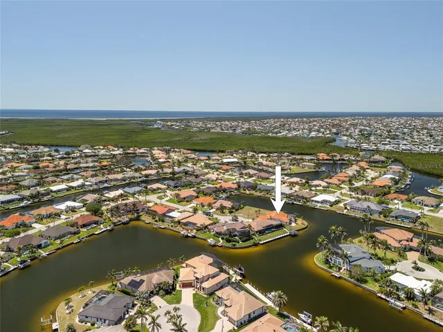 an aerial view of a house with a swimming pool