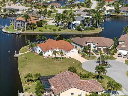 a view of a swimming pool and lounge chairs