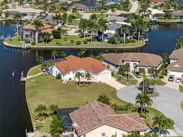 a view of a swimming pool and lounge chairs