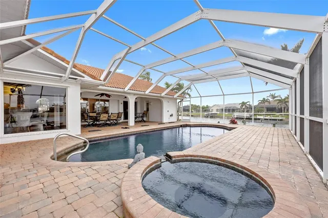 a view of a swimming pool with a patio